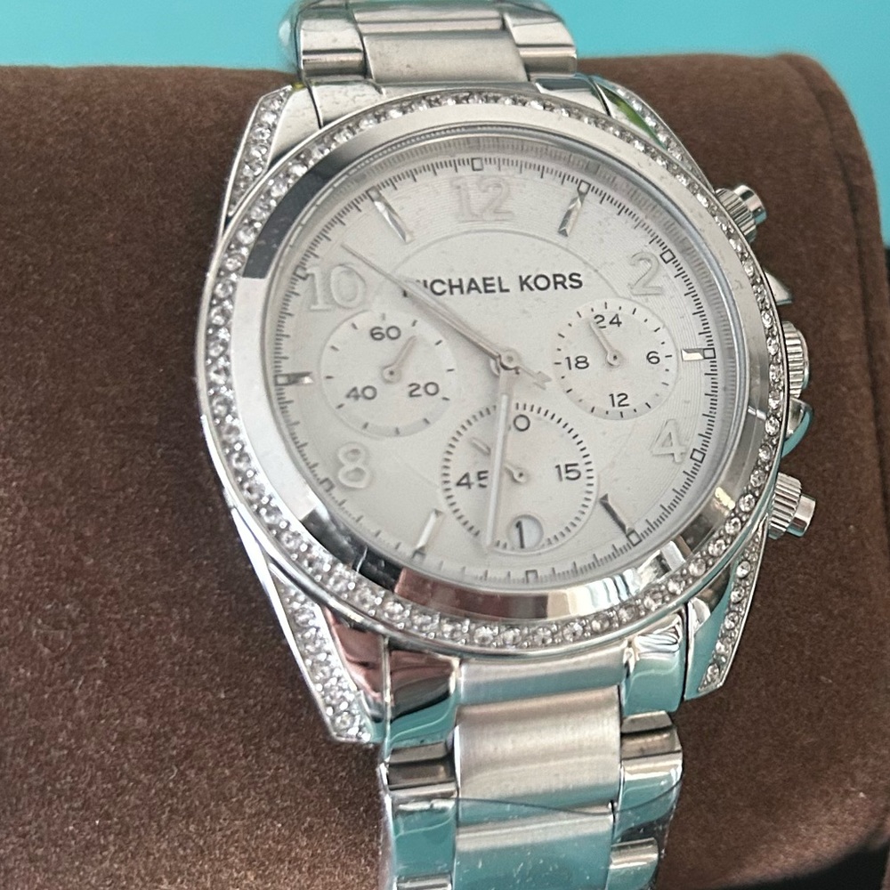 BRAND NEW/NEVER WORN. Michael Kors watch. Bout time to move on this deal.